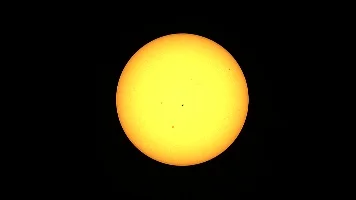 The Sun, with few sunspots visible.