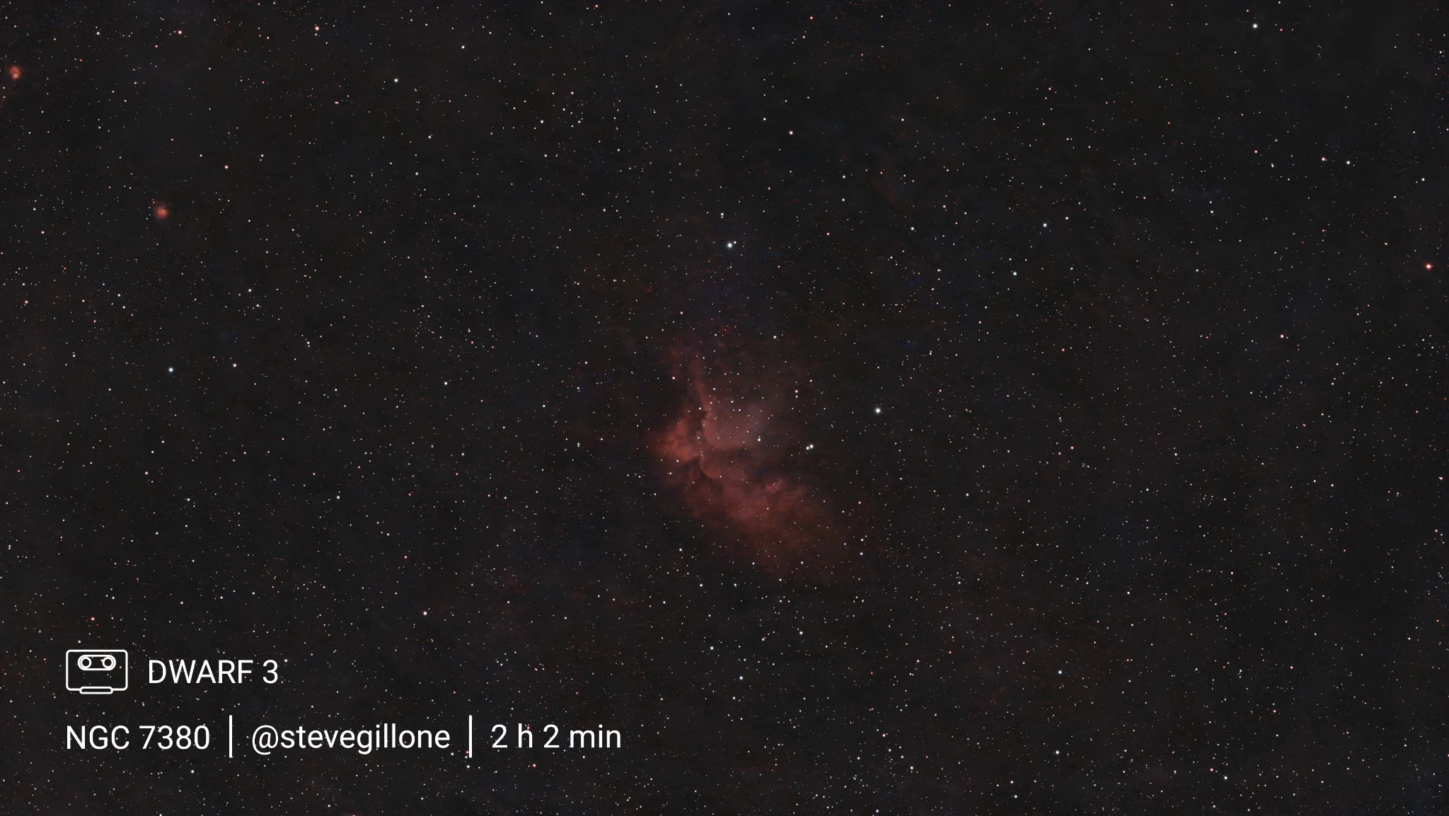 Captured with the DWARFLAB DWARF 3, NGC 7380 (the Wizard Nebula) reveals its distinct cloaked figure amidst glowing hydrogen gas and dark interstellar dust in Cepheus. The smart telescope's dual-band filter and automatic stacking cleanly isolate vibrant crimson emissions and delicate stellar nursery structures against a dense, rich field of background stars.